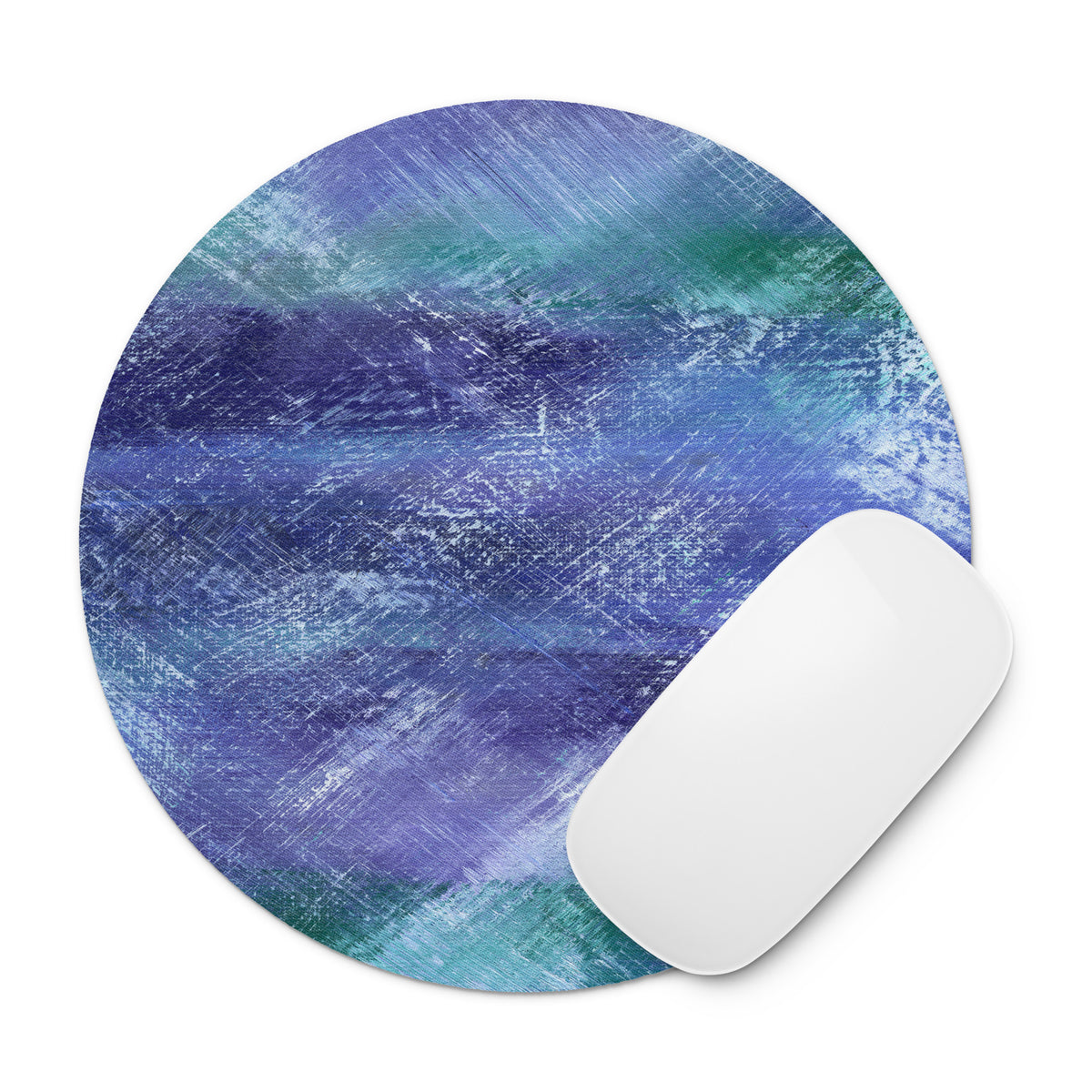 A round mouse pad with a blue and purple and teal watercolor texture with a white computer mouse on a white background.
